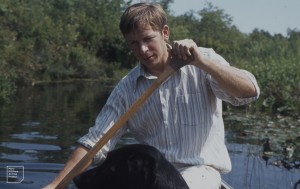 Arthur Gaines in stern of canoe on River Chipuxet