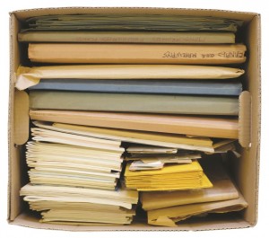 A box of folders, photographs and negatives