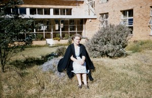 Me in grounds of University Women’s College, Melbourne. Covered way and dining hall behind. My old room right.